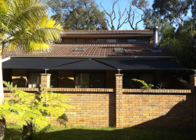 Black well covered side of house