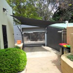 Black between house and shed